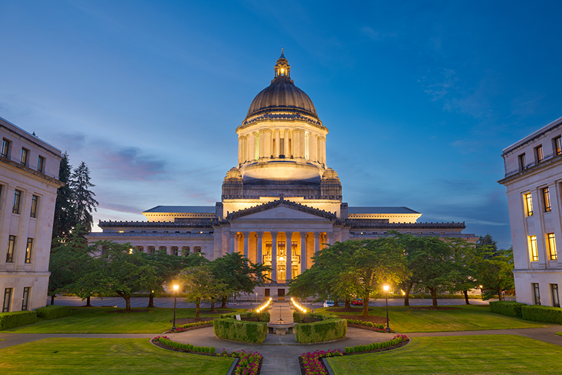 Government agency professionals meeting with community members inside state capitol